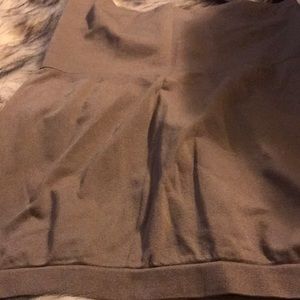 Shapewear  long strapless top. Has a material inside holds it in place